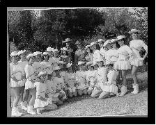 Group shot of the Kilgore Rangerettes with John and Peter